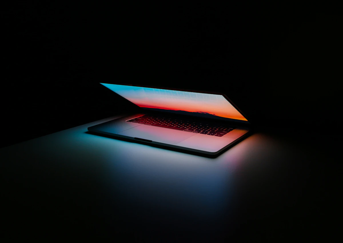 Laptop on a dark surface